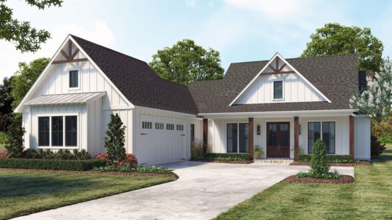 A front view of a modern farmhouse-style home with a charming and rustic appeal. The exterior features white board and batten siding, a dark shingled roof, and exposed wood accents on the gable ends and columns. The house has a prominent front porch supported by wooden columns, leading to a set of double doors. To the left, there is a two-car garage with matching white siding and a dark roof, with decorative hinges on the garage doors. The landscaping includes a neatly manicured lawn, shrubs, and flower beds along the front of the house, with trees and greenery in the background under a partly cloudy sky.